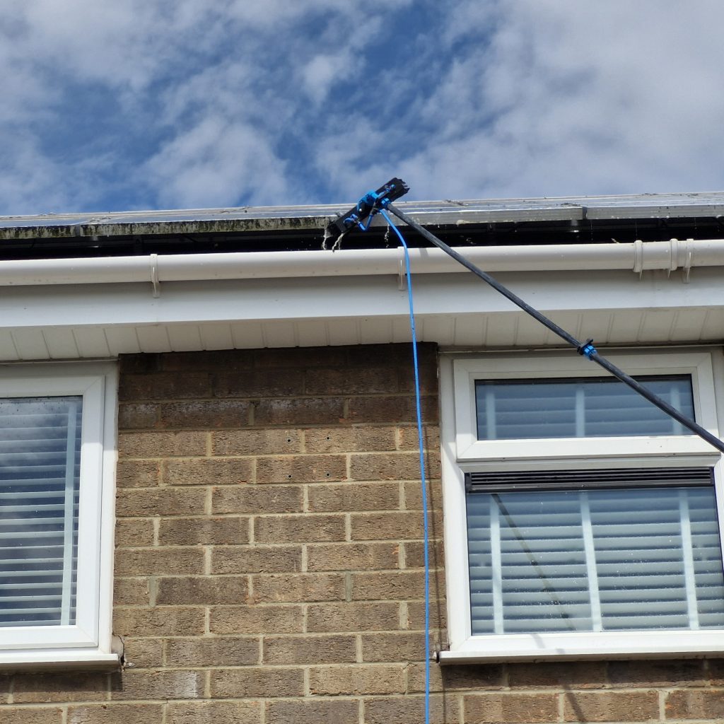 Gutter cleaning in progress